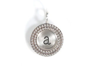 Single Initial Round Charm with a Leo Frame