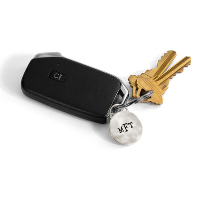 Round silver monogram keychain with keys 